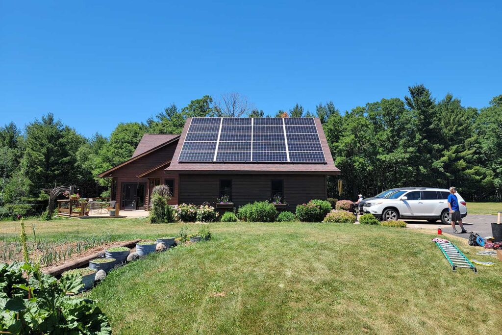 Solar Panels for Real Estate and Homeowners, building with solar panels on clear day in Wisconsin